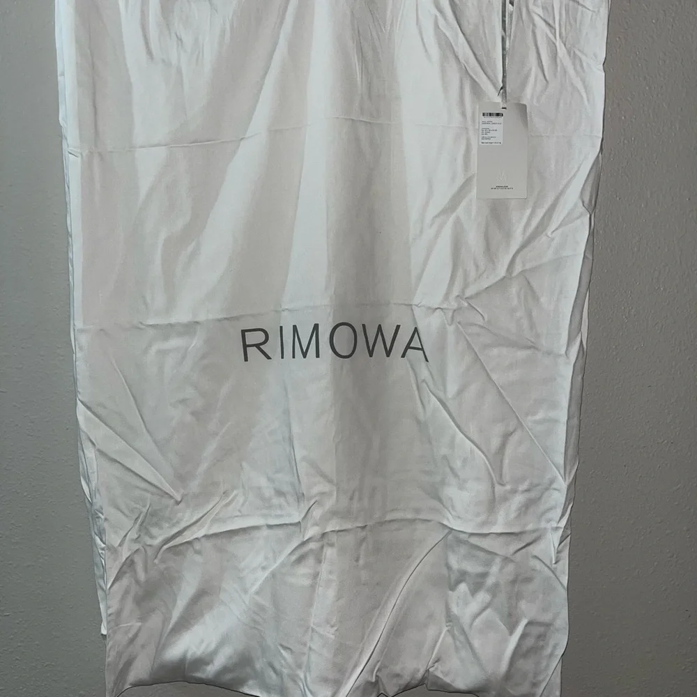AVAILABLE July 17th    RIMOWA White Protective Luggage Cover with Tag - Picture 2 of 10
